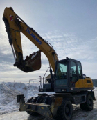 Аренда колесного экскаватора.
